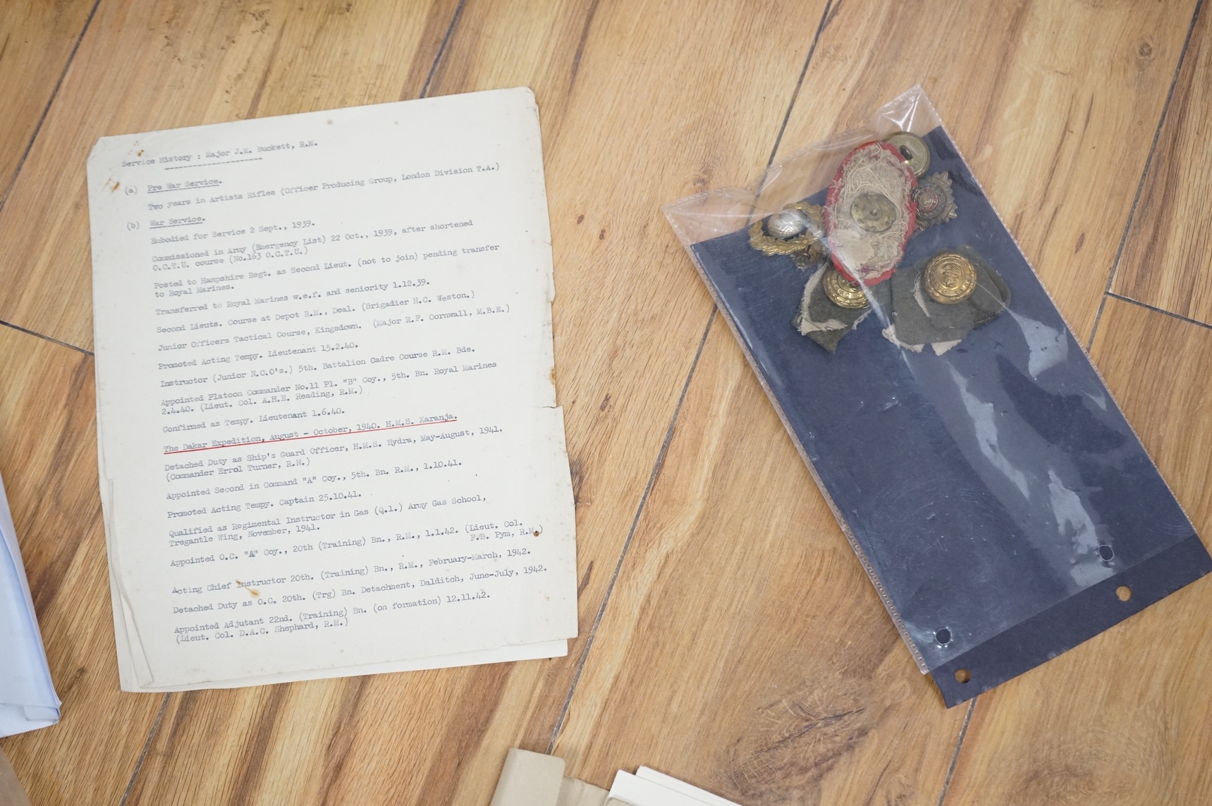 WWII D-Day and Operation Neptune related interest; an archive of mainly naval documents, maps and photographs relating to the invasion of Juno beach, 6 June 1944, comprising; the personal papers, maps, and other document